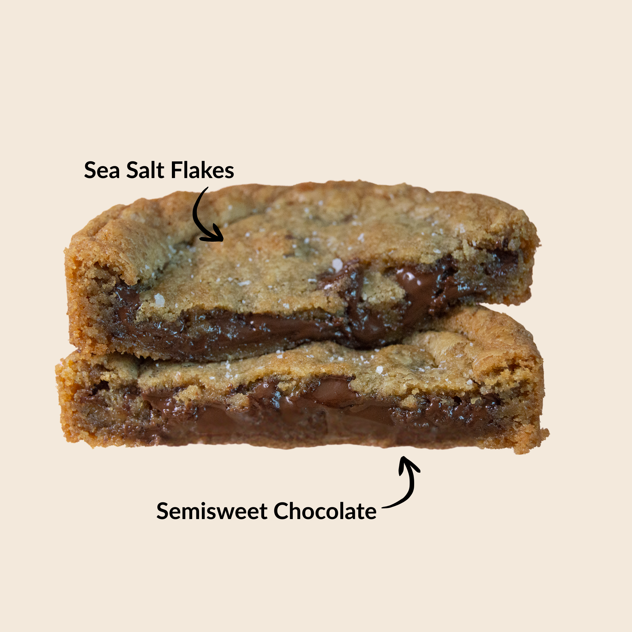 chocolate chip cookie with sea salt flakes and semisweet chocolate on a beige background.