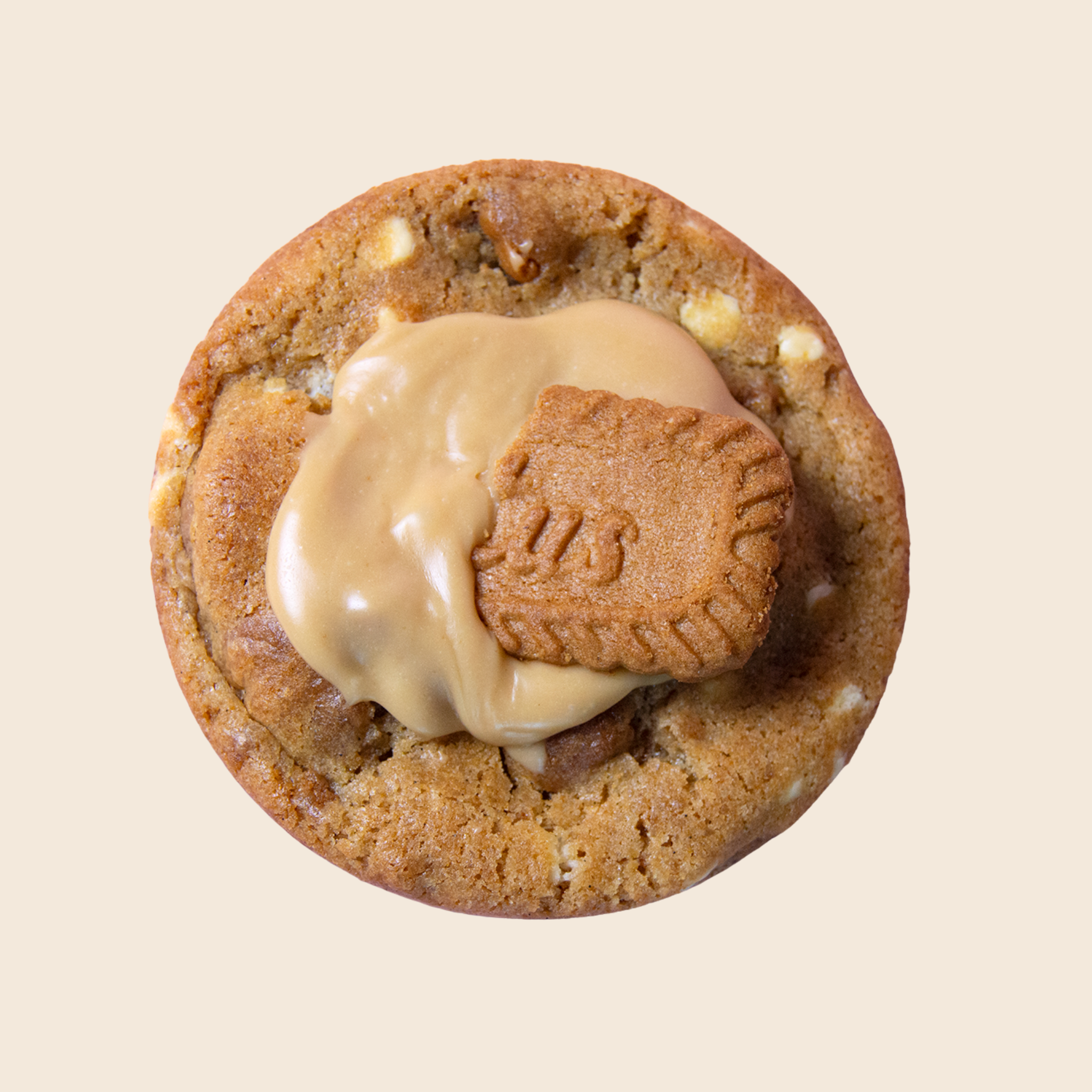 Cookie with cookie butter ganache and a cookie piece on top against a beige background