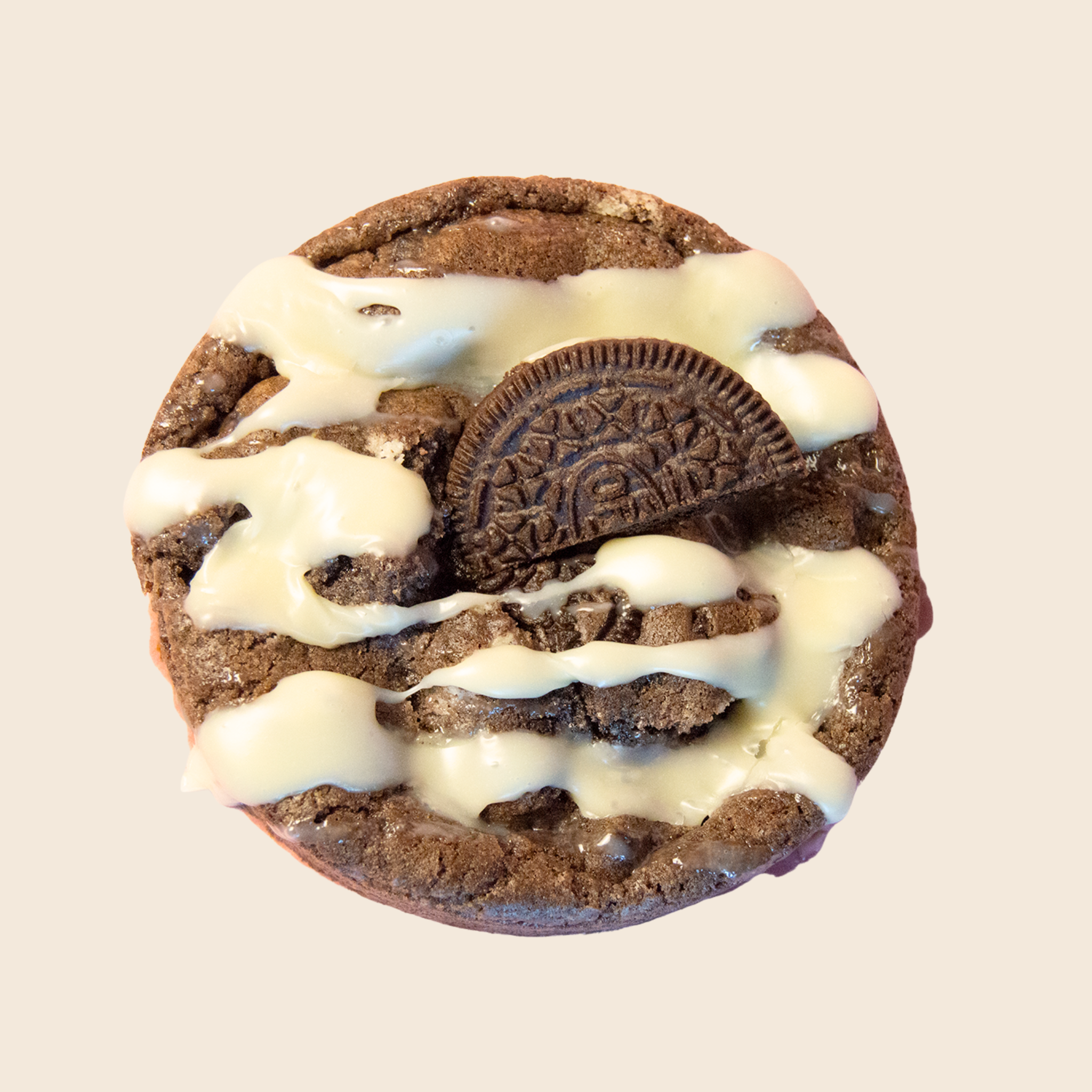 Chocolate cookie with white ganache and an Oreo cookie on a beige background