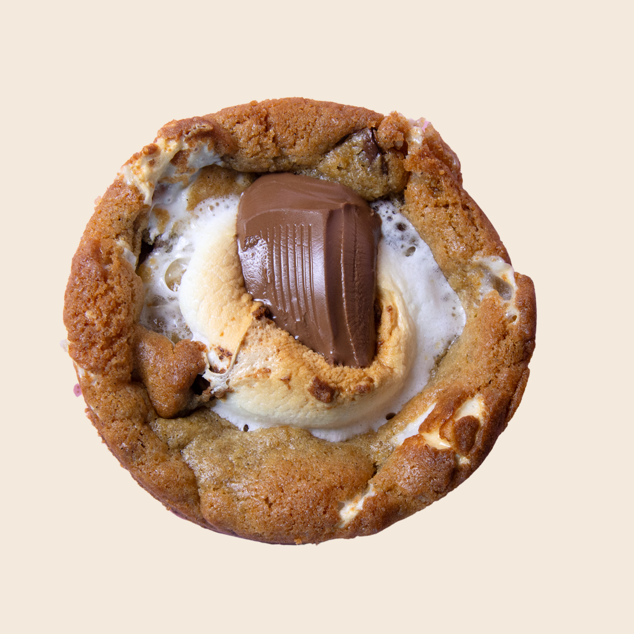 Cookie with chocolate and marshmallow filling on a beige background